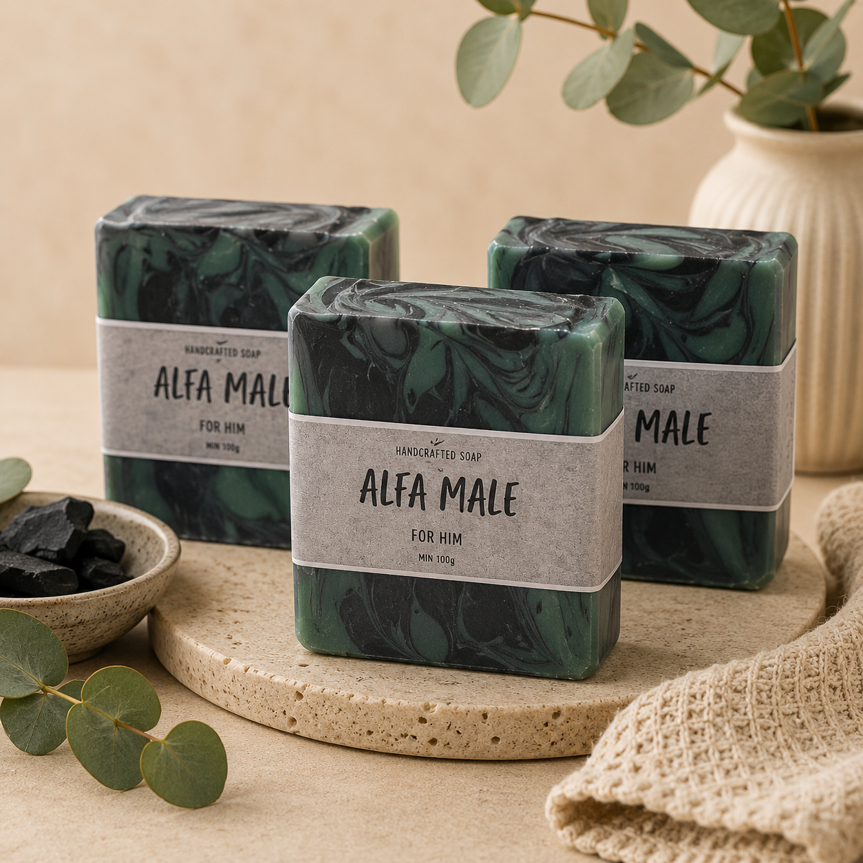 Three green marbled soap bars with 'Alfa Male' labels on a beige surface.