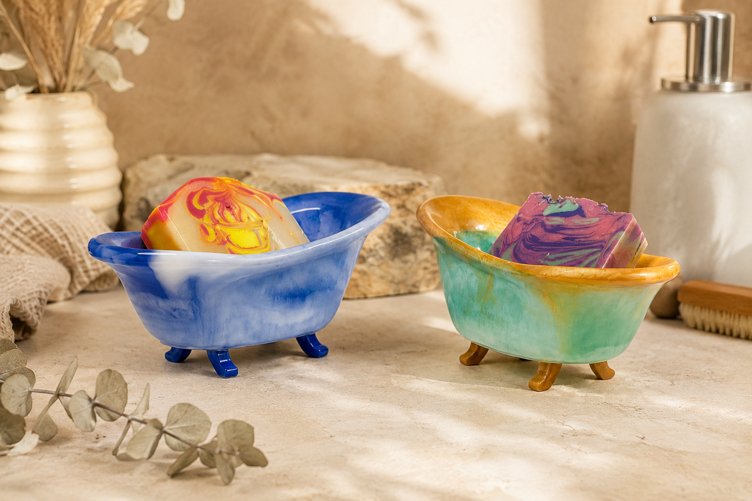 Two resin soap dishes with colorful soap on a wooden surface.