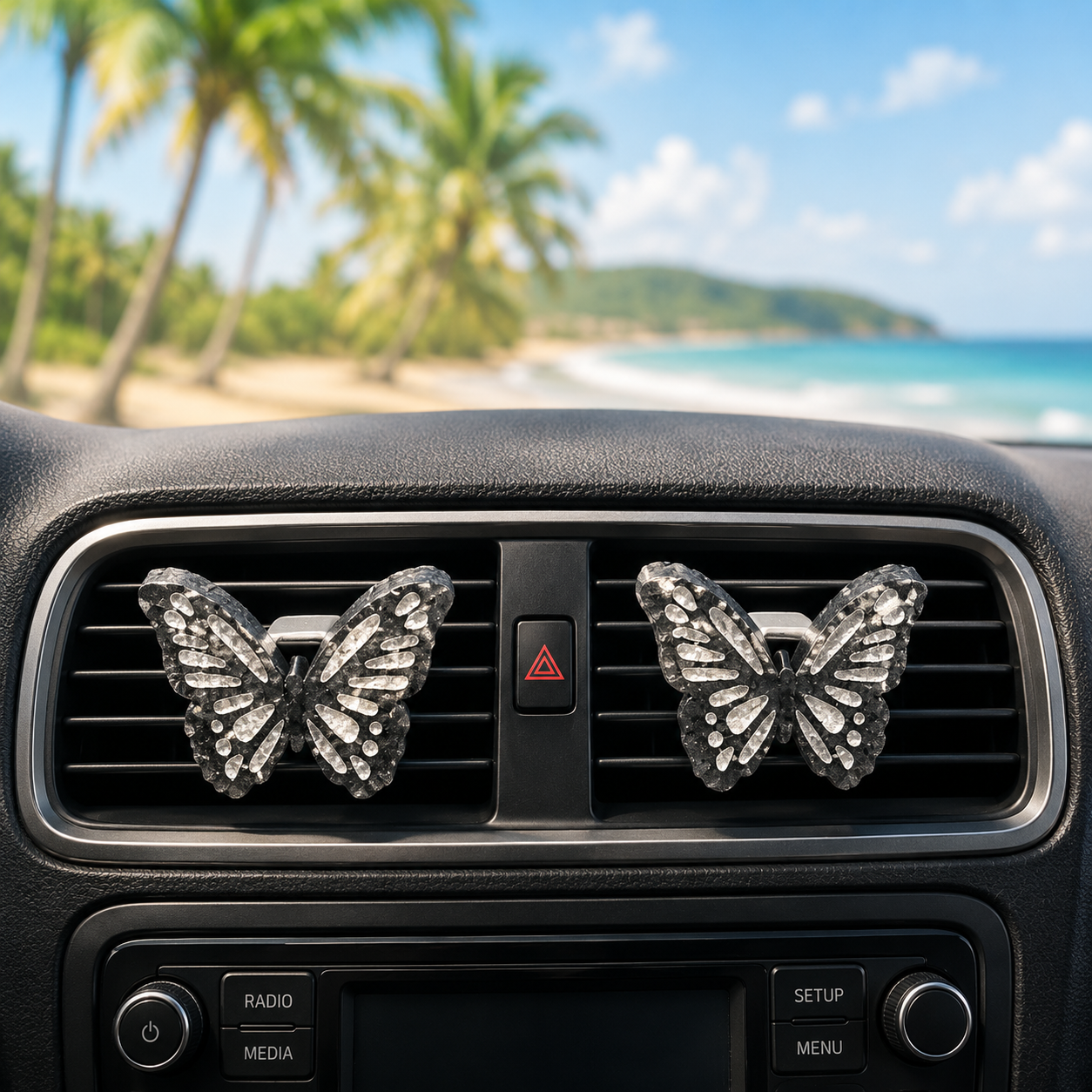 Butterfly-shaped car air fresheners on a car dashboard with a beach background