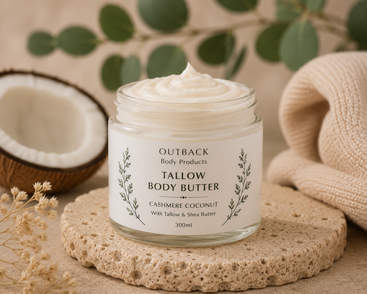 Jar of Outback Tallow Body Butter with coconut and eucalyptus in the background
