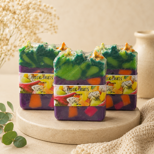 Colorful soap bars with 'Exotic Fruits' packaging on a wooden stand.